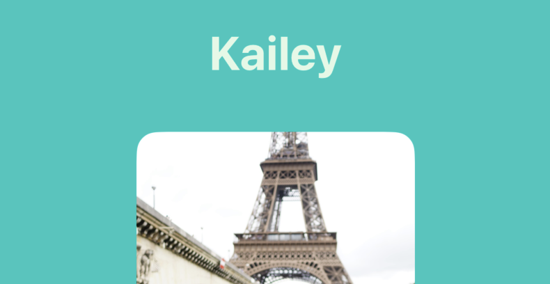 A teal background with a picture of the Eiffel Tower.