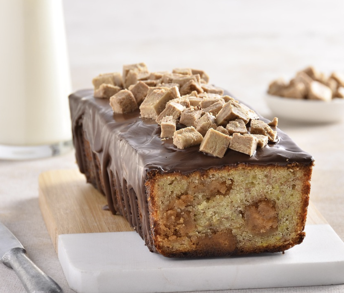 A loaf of banana bread on a cutting board.
