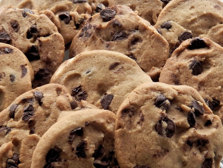 Classic chocolate chip cookies spread apart.