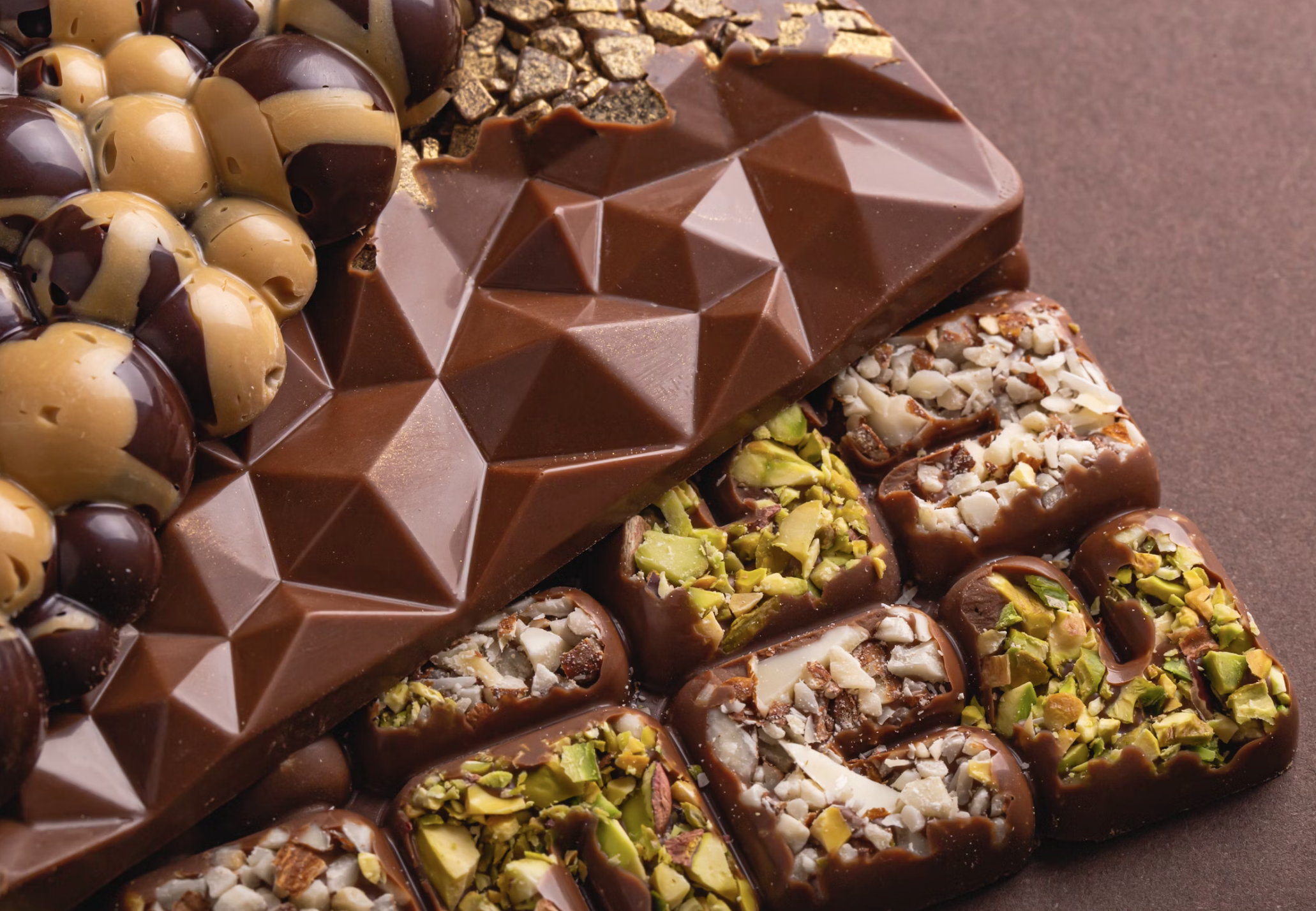 Chocolate bars in very unique shapes filled with pistachios.