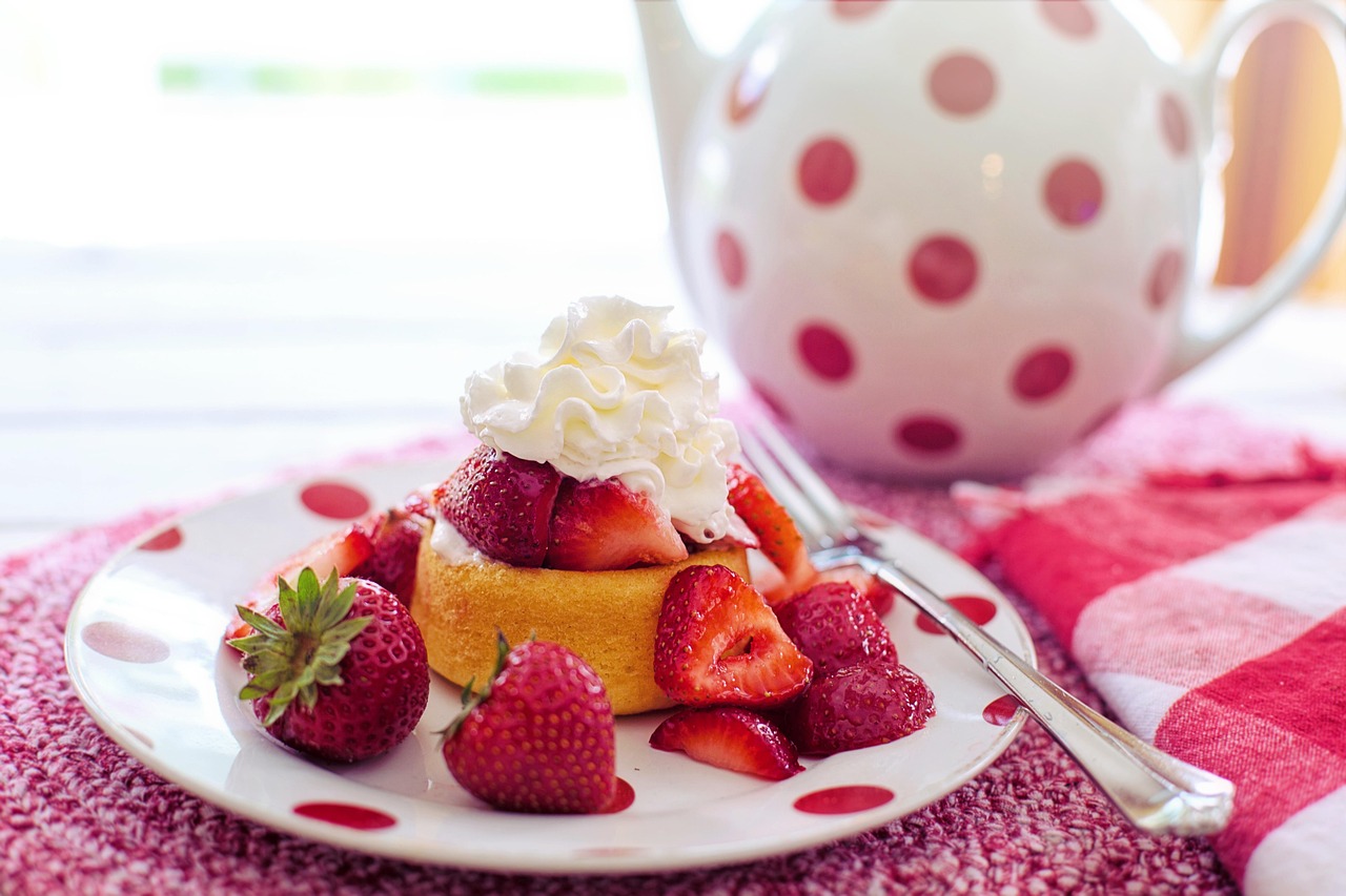 A strawberry shortcake with many strawberries and whipped cream.